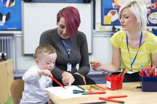 boy special needs Down syndrome nursery school teacher parent