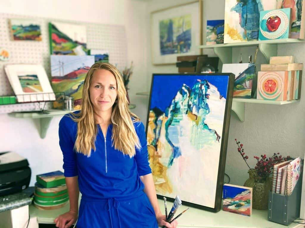 Authentic Artist Mom on the Street Abigale Palmer with her paintings