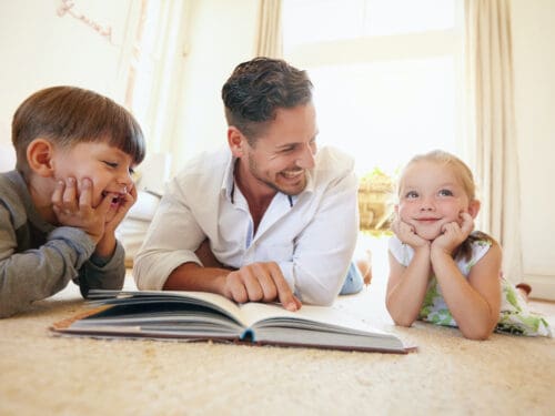 father and kids reading - bibliotherapy