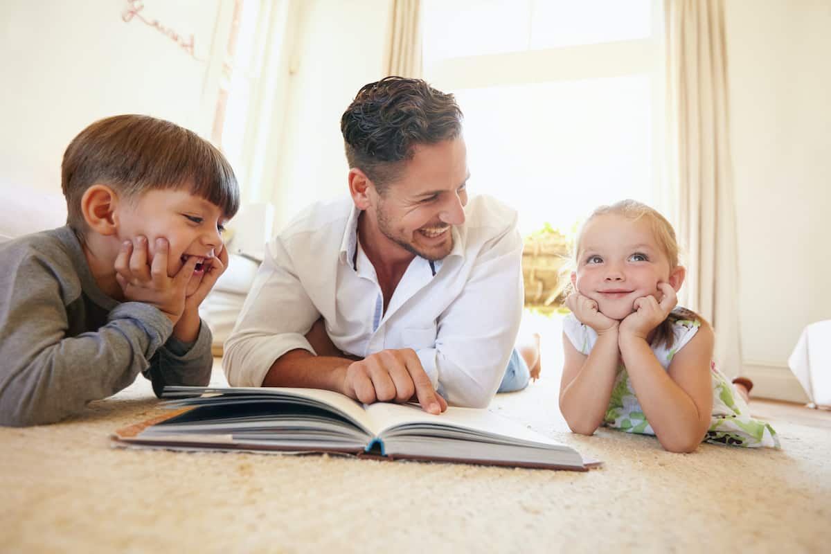 father and kids reading - bibliotherapy