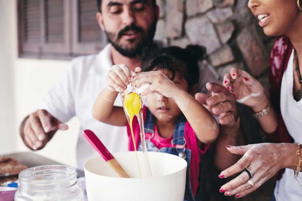 family baking cooking with kids together