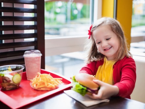 girl eating healthy fast food for kids