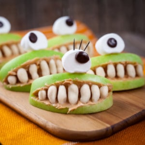 peanut butter apple slices with eyeballs healthy Halloween snacks