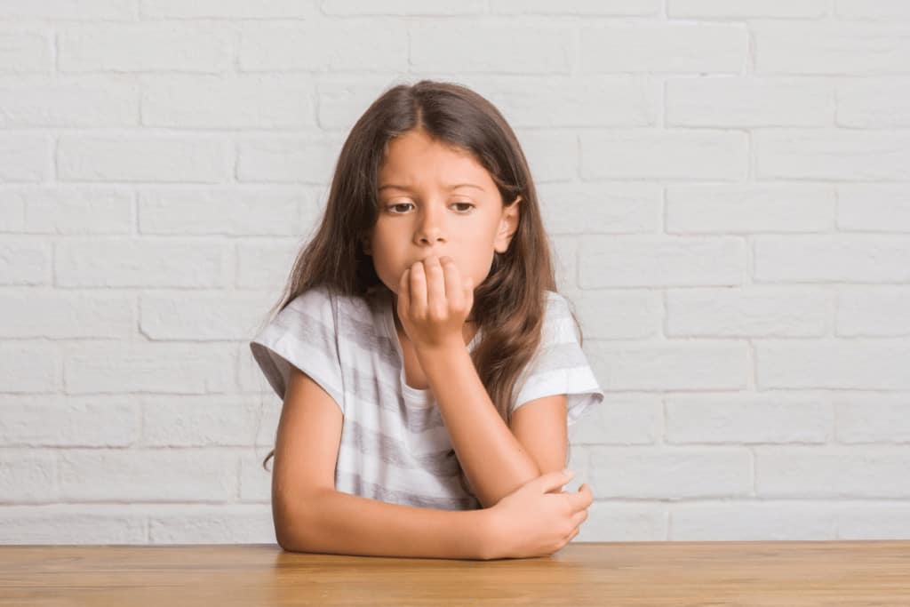 anxiety in children - girl looking anxious and worrying