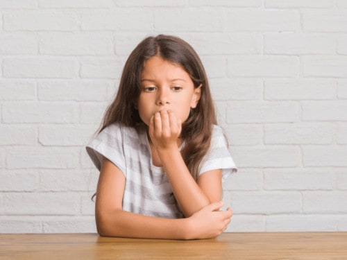 anxiety in children - girl looking anxious and worrying