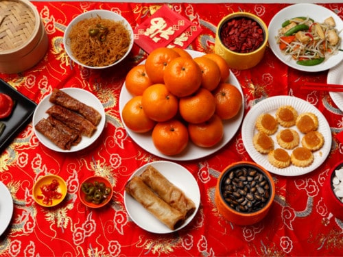 oranges, noodles, sweet rice cakes, Chinese new year food
