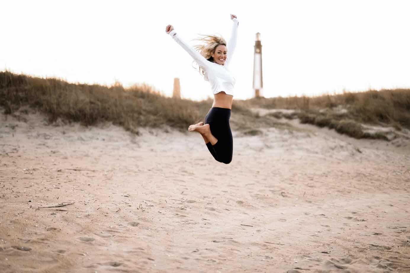 Amanda Cabrera-Crowe Elev8 Fit Mom jumping on the beach